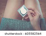 Girl on a table with condom book heart nameplate foot pants. hd