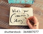 Retro effect and toned image of a woman hand writing a note with a fountain pen on a notebook. Handwritten text WHAT'S YOUR SUCCESS STORY ?, business success concept