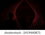 a red laser display cuts through the silhouette of a person on the left. background that can be used as a design asset or editing resource. Clubbing, dance music theme