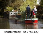 Aged Couple On Narrow Boat In...