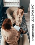 Small photo of Counseling and therapy patient talking of problem, health expert listening. Therapist comforting a patient. Psychotherapy session, woman talking to his psychologist. Woman talking to her psychologist.