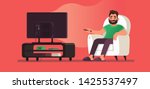 man watches tv while sitting in ... | Shutterstock .eps vector #1425537497
