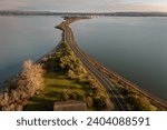 Small photo of Aerial view of Semiahmoo spit with Drayton Harbor on one side and Semiahmoo Bay on the other.Walking the trail system on Semiahmoo Spit is a popular regional activity and leads to the Semiahmoo Resort