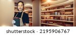 Small photo of concept of a woman working in a library and a book. Bookstore. Librarian. Curator. Wide image for banners, advertisements.