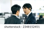 Small photo of Asian businessman boss yelling at subordinate in modern office.