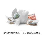 stock-photo-broken-piggy-bank-with-money