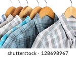 shirts with ties on wooden... | Shutterstock . vector #128698967