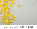 Paper yellow butterflies fly on ...