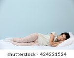 Young Woman In Pajamas Sleeping ...