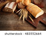 Fresh Bread On Wooden Table