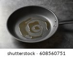 Pan with oil on gray background