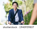 young asian business man riding ... | Shutterstock . vector #1940959837