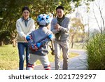 loving asian parents teaching... | Shutterstock . vector #2021729297