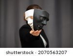 Small photo of mask drama and comedy in theatre holds the actor before going out to the stage for play performance, chooses between a black and white hero