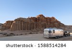 Small photo of RED ROCK CANYON STATE PARK, CA/USA - FEBRUARY 26, 2017: Airstream Travel Trailer shown against the Red Cliffs at Red Rock Canyon State Park.