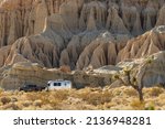 Small photo of Red Rock Canyon State Park, California, USA - February 24, 2022: image of an Airstream trailer and truck shown against an eroded mountain side.