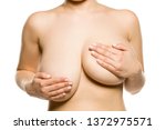 A woman with univen big breasts on white background