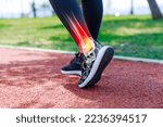 Small photo of Female athlete walking on track field, low angle view of her shoes and ankle with x-ray image showing sportive injury. Sports injuries concept