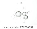 Large and clear water bubbles floats over a white background