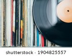 Close up of vinyl record with records collection	