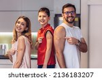 Small photo of Coronavirus Vaccination. Vaccinated Family Of Three With Adhesive Bandage On Arms Posing At Home After Getting Covid-19 Vaccine