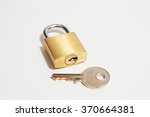 Padlock With Key On A White...
