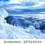 Small photo of Small snowdrifts are scattered around the picturesque wintry backcountry overlooking the Vogel ski resort slopes. Spectacular shot of gorgeous winter wonderland in the Slovenian part of Julian Alps.