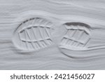 Footprint of shoe in the white sand