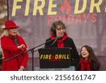 Small photo of WASHINGTON, DC - December 27, 2019: "Grace Frankie" co-stars Jane Fonda and Lily Tomlin banter on stage during a Fire Drill Fridays climate change protest at the United States Capitol.