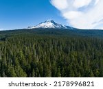 Mt. Hood rises from surrounding forest in Oregon, not far from Portland. This impressive mountain, part of the Cascade Range in the Pacific Northwest, is a potentially active stratovolcano.