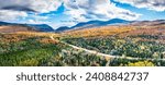 Small photo of Aerial panorama US route 302 leading to Crawford Notch State park between Mount Webster and Willard. Mt Jackson (left), Willey, Field and Tom (right) are visible in the back.