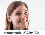 Small photo of Young female's cheerful countenance and bright smile illuminate her light-hearted spirit