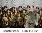 Small photo of SEVASTOPOL, REPUBLIC OF CRIMEA - MARCH 11, 2015:The soloist of the Academic song and dance ensemble of the internal troops of the Ministry of internal Affairs of Russia Vitaly Gerasimenko performs