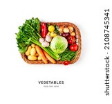 Small photo of Vegetables in basket isolated on white background. Cabbage, celery, potato, pepper, onion, carrot, garlic, lemon, tomato and herbs creative arrangement. Healthy eating concept. Flat lay, top view