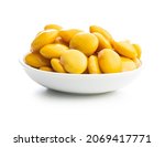 Pickled yellow Lupin Beans in bowl isolated on white background.