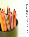 colour pencils in a cup | Shutterstock . vector #310322327