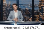 Small photo of Serious anchor woman talking at newscast modern multimedia channel close up. Confident lady newsreader covering daily news in television studio. Female newscaster ending late night program on tv