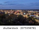 Small photo of DUBUQUE, IOWA - OCTOBER 2021 - A Wide Angle Cityscape Shot Overlooking Dubuque, Iowa Illuminating during a Fall Twilight