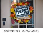 Sorry we're closed sign hanging in a door