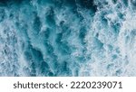 Small photo of Beautiful texture of big power dark ocean waves with white wash. Aerial top view footage of fabulous sea tide on a stormy day. Drone top shot breaking surf with foam in Indian ocean. Big swell in Bali