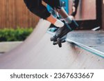 Small photo of Skate park with kids on a kick scooter doing tricks and stunts, boys in a skate park riding bmx bike and skate, playing and enjoying summer on new ramp, teenagers skateboarders and bmx riders