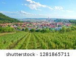 Stunning panoramic landscape with rows of vineyards around beautiful Czech city Mikulov with dominant Mikulov Castle. Located in Moravia region, which is mainly in summer a popular tourist destination