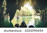 Small photo of Entrance of Puerto Princesa Palawan subterranean underground river - Adventurous exclusive Philippines destinations seven nature wonders - Contrast back lighting filter with point of view composition