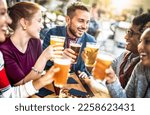 Small photo of Young people drinking beer pints at brewery bar garden - Genuine beverage life style concept with guys and girls sharing happy hour together at open air pub dehor - Warm sunset backlight filter