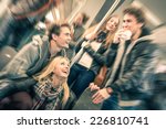 Group of young hipster best friends having fun interaction and talking in subway train - Vintage filtered look with radial defocusing - Concept of youth and friendship with happy people