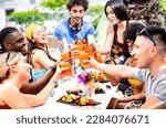 Small photo of Fancy people drinking cocktails at poolside party - Young friends having fun on luxury resort - Diverse life style concept with guys and girls toasting drinks and fruit together - Bright vivid filter