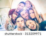 Best friends taking selfie outdoors with backlighting - Happy friendship concept with young people having fun together - Cold vintage filtered look with soft focus on faces due to sunshine halo flare