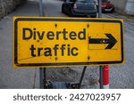 Small photo of Diverted traffic sign in yellow and black