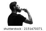 Small photo of Black and white portrait of bearded man with hair brush on white. Trendy and stylish beard styling and cut. Brutal young bearded man. Stylish man brushing his beard and moustache