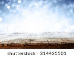 beautiful blue blurred background of winter and shabby table 